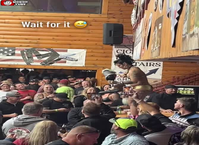 Video :Sturgis Motorcycle Rally - A bartender pours booze into a customer's mouth as a man sips beer through his prosthetic leg